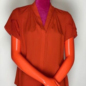 Solid tomato blouse.